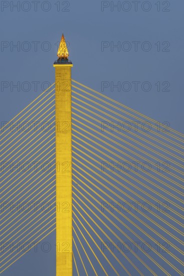 The illuminated Rama VIII Bridge, a cable-stayed bridge across Mae Nam Chao Praya, Bangkok,