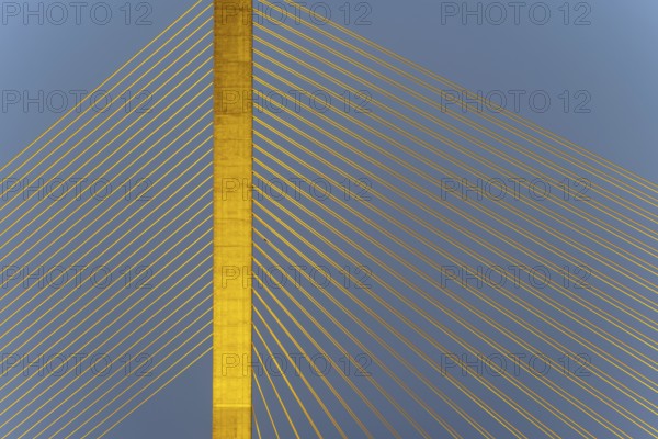 The illuminated Rama VIII Bridge, a cable-stayed bridge across Mae Nam Chao Praya, Bangkok,