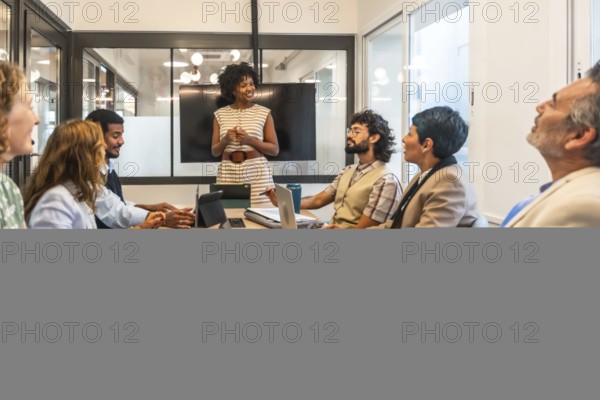 Diverse business professionals conducting a collaborative meeting in a modern office boardroom,