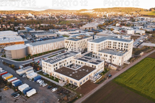 Aerial view of a city panorama with modern buildings and adjacent fields, new hospital, Calw health