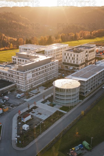 Modern buildings in autumn light with surrounding nature and gentle sunset, new hospital, Calw