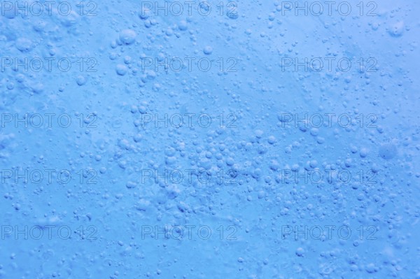 Close-up of air bubbles trapped within glacial ice at Mohnbukta, bay at Storfjorden in Sabine Land