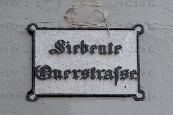 Seventh Cross Road, a historic street sign in the old town, Hanseatic City of Lübeck,