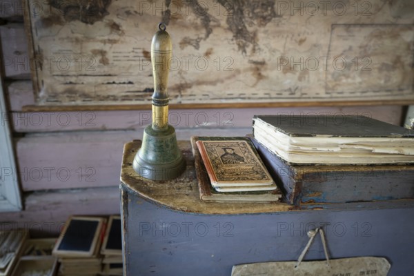 Bell and teacher's desk, old map in the background, 19th century school, Øygarden from Vågå,