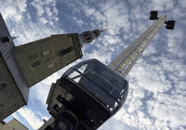 View from bottom to top of the Look 360 degree mobile skylift and of St. Peter's Church, All Saints