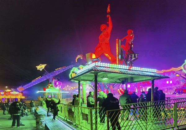 Colourfully illuminated All Saints Fair at night, the largest old town fair in Europe, Soest, North