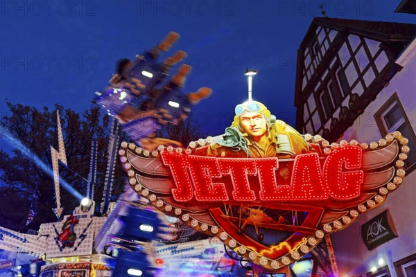 Jet lag ride at the All Saints Fair in front of a half-timbered house, Altstadt, Soest, North