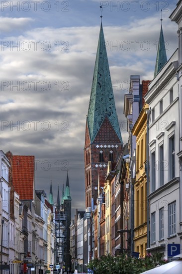 Shopping street with historic houses and the towers of St. Mary's Church, Hanseatic City of Lübeck,
