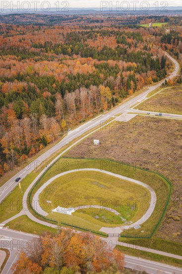 Roundabout surrounded by autumn leaves and extensive countryside, new Lindenrain industrial park,
