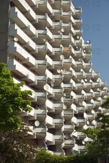 High-rise apartment building with balconies and satellite dishes, satellite town of Chorweiler in