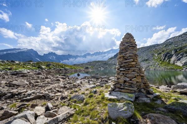 Steinmännchen am See mountain lake, picturesque mountain landscape with dammastock and damma