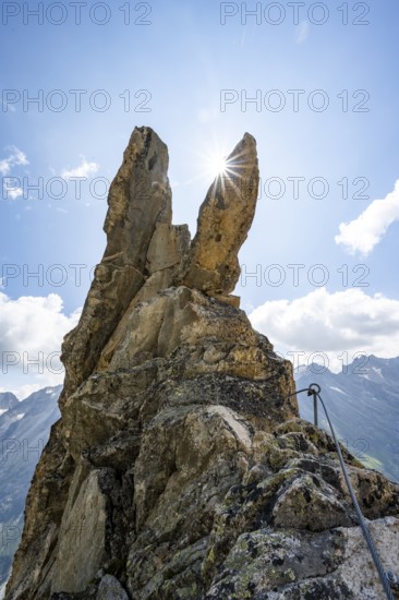Crocodile rock formation with sun star, via ferrata Krokodil-Bergsee am Bergseeschijen-Vorbau,