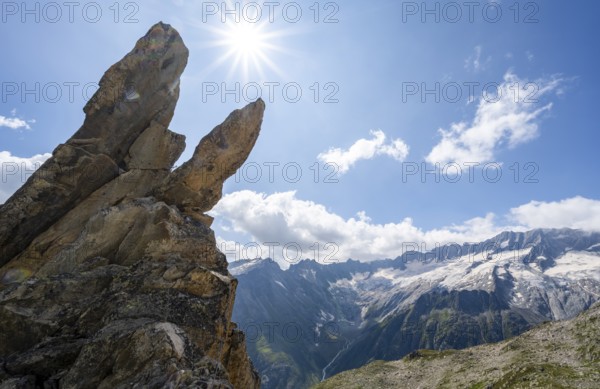 Crocodile rock formation with sun star, view of dam glaciers and dammastock, via ferrata crocodile