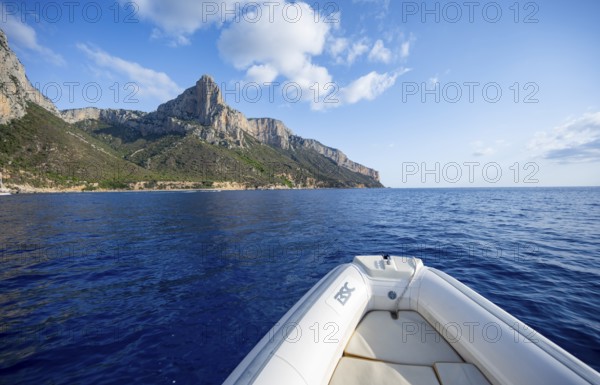 Motorboat trip along the picturesque rocky coast, cliffs and blue sea, Golfo di Orosei, Baunei,