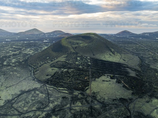 Montaña Negra volcano, picturesque volcanic landscape with volcanic crater at sunrise, Parque