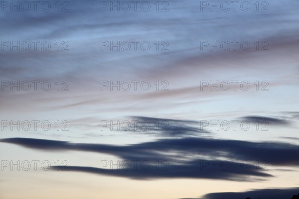 Pastel-coloured cloud formations in the evening sky, Peenetal nature park Park, Mecklenburg-Western