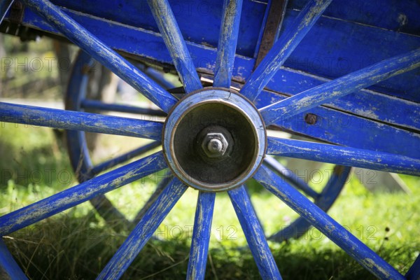 Blue-painted spokes of a wooden cart, Maihaugen open-air museum with houses and objects from farms