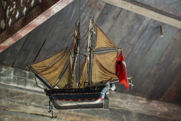 Votive ship in the interior of Garmo Stave Church, Maihaugen open-air museum with houses and