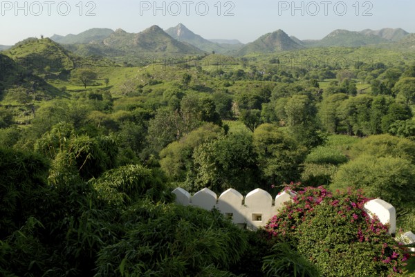 Hilly, green landscape of Aravalli Mountains in monsoon, view from Palace Hotel Devigarh, Delwara