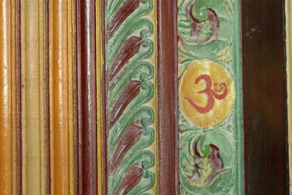 Painted wood carving, Om sign, Kalari Kovilakom, Ayurveda Palace of the Cgh-Earth Hotel Group,