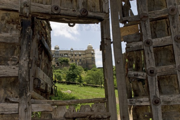 Old, heavily fortified wooden gate, Palasthotel Karni Fort Bambora entrance, Bambora, Rajasthan,