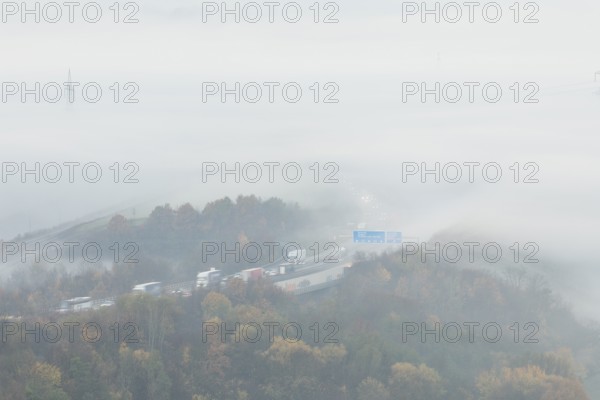 Aichelberg Alb climb of the A8 in thick fog on an autumn morning. Lkr. Göppingen,