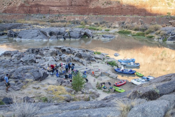 Loma, Colorado - Many children are part of a river rafting group camped in Ruby Canyon along the