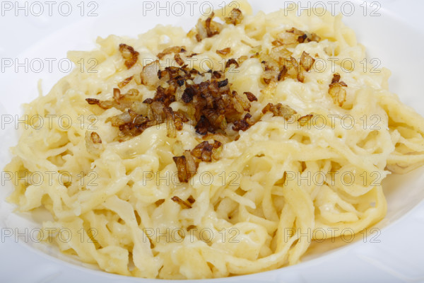 Swabian cuisine, cheese spaetzle, Swabian spaetzle baked with cheese, onion melt, hand-scraped