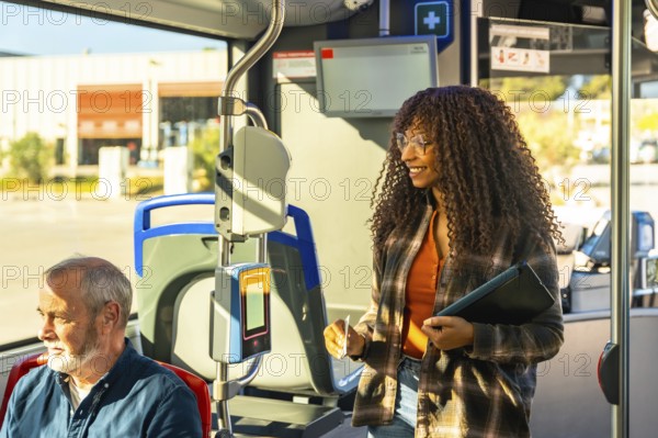Young woman smiling while validating her transit card on a public bus, traveling in a city