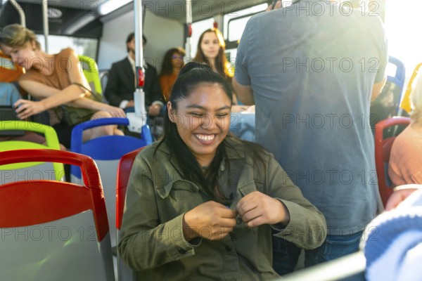 Young woman with closed eyes expressing joy and contentment while traveling on public