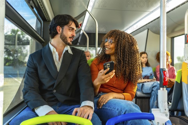Diverse couple traveling on a public bus, the woman showing content on her smartphone to the man