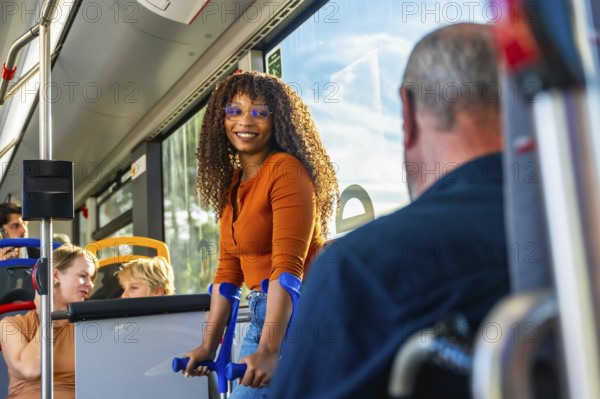 Young black woman on crutches smiling aboard a city bus, embodying accessibility, inclusion and
