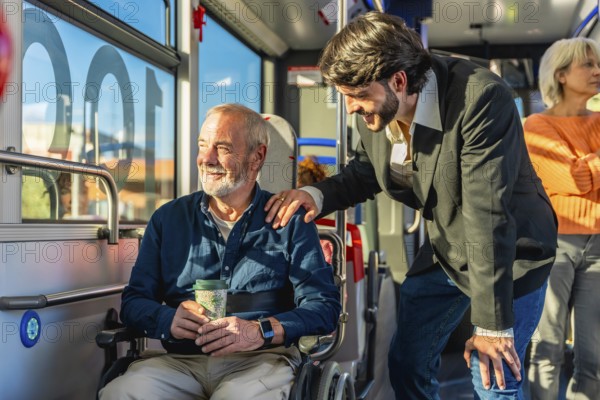 Young man offering support and kindness to a smiling senior passenger using a wheelchair,
