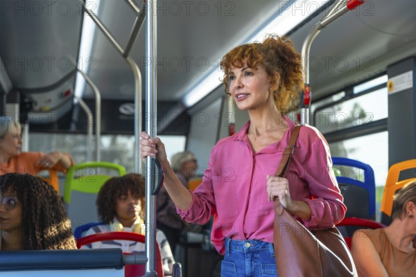 Mature woman standing and holding onto a pole inside a city bus, commuting to work or journeying
