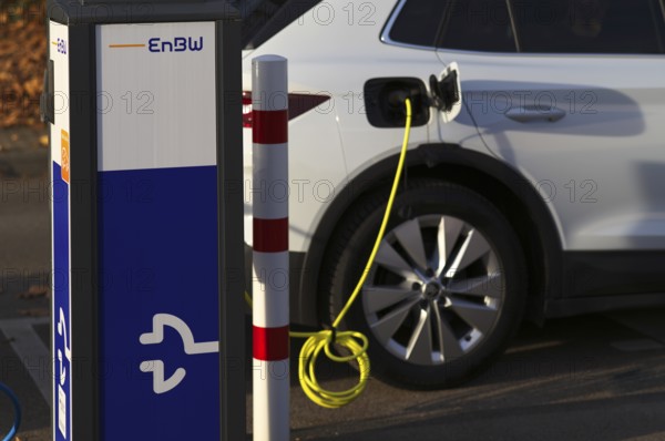 Parking lot with gas pump, EnBW charging station for electric cars, charging station, e-charging