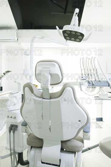 Modern dental clinic with a comfortable chair and equipment for patient care in a bright, clean
