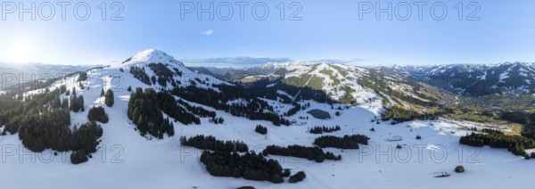 Wonderful winter landscape with Hohe Salve, blue sky and snow, mountains and mountain valley,