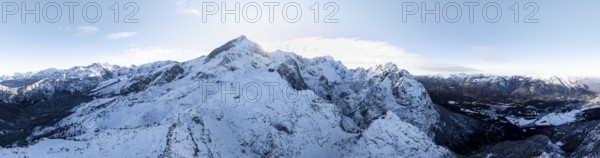 Wonderful winter landscape with Zugspitze, blue sky and snow, mountains and mountain valley, aerial