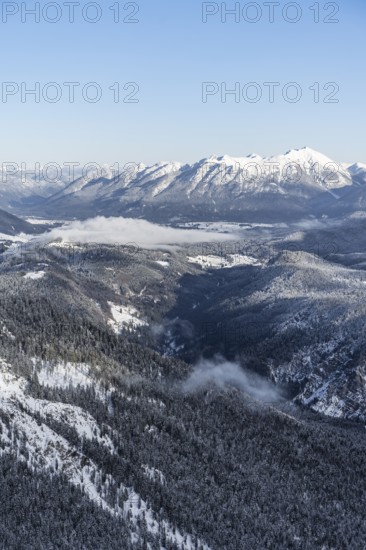 View of snow-covered mountain landscape across the Reintal towards the Estergebirge and