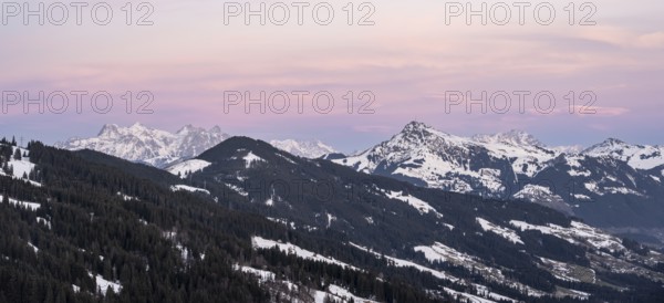 View of Brixental in winter, with peaks of the Kitzbühler Horn and Loferer Steinberge in the back,