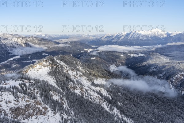 View of snow-covered mountain landscape across the Reintal towards the Estergebirge and