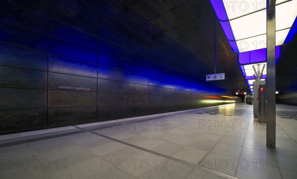 HafenCity University subway station, illuminated in color, blue, underground train, movement