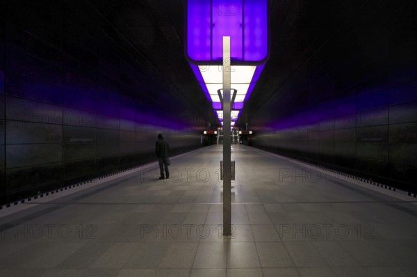 HafenCity University subway station, illuminated in color, purple, traveler, platform, stop, train