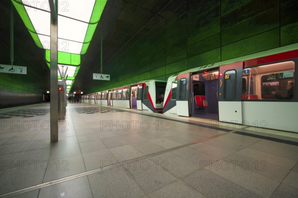HafenCity University underground station, illuminated in color, green, underground train, U4,