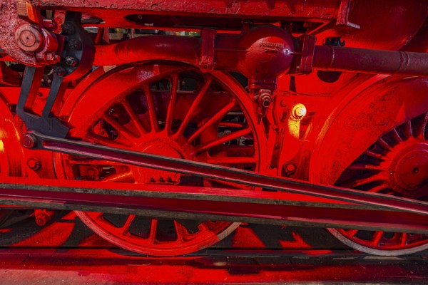 Illuminated wheelwork of a historic locomotive, railway museum, Augsburg railway park,