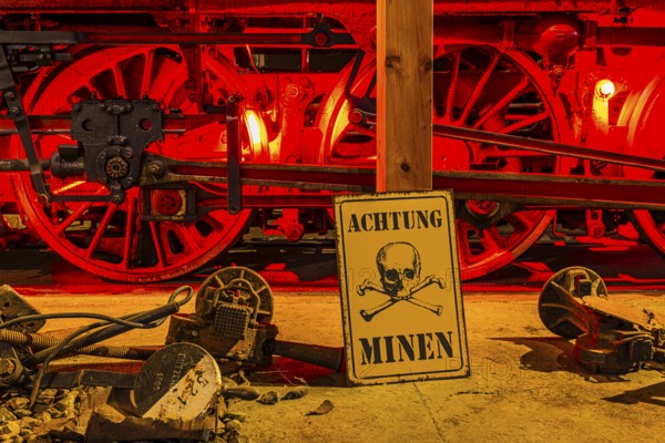 Illuminated wheelwork of a historic locomotive, replica of a mine warning, railway museum, Augsburg