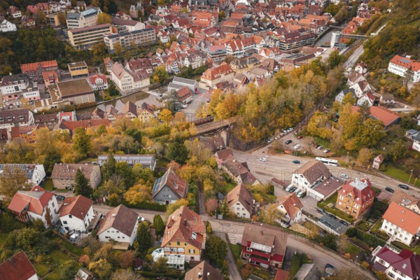 The picture shows the structure of a medieval town surrounded by autumn nature, Calw, Black Forest,