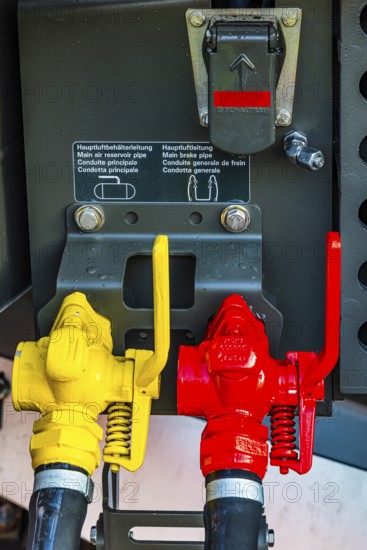 Yellow and red lever for main air lines on a modern railway locomotive, Augsburg railway park,