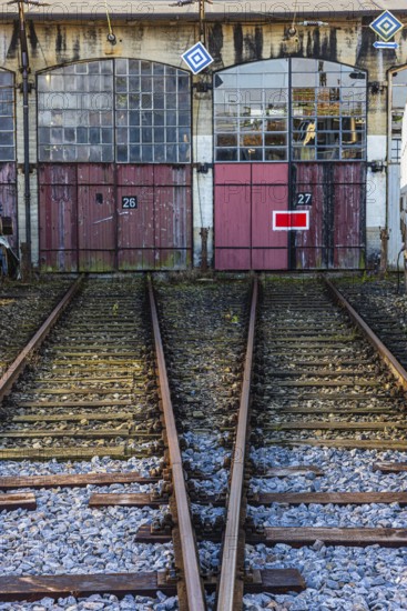 The entrance gates 26 and 27 and railroad tracks of the old engine shed, Augsburg railway park,