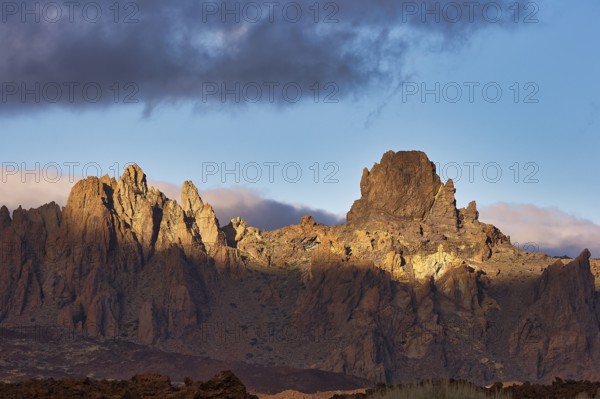 Dramatically illuminated rocks under a partly cloudy sky, UNESCO World Heritage Site, Teide